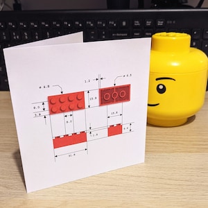 Een kaart met een illustratie van een LEGO®-achtige steen, met technische afmetingen. Pas tekst aan/voeg tekst toe!