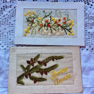 Hermoso par de postales navideñas originales de Bonne Annee bordadas francesas de la década de 1920 con efímeras de papel antiguo escritas a mano.