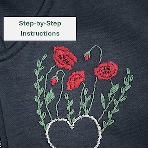 May include: A black hoodie with a zipper closure and a heart-shaped design embroidered with white beads. The heart is surrounded by green leaves and red poppy flowers. The text "Step-by-Step Instructions" is at the top of the image and "PDF Pattern" is at the bottom.