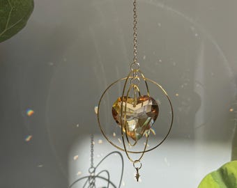 Gold Orbital Ring Suncatcher with Champagne Crystal Heart Prism
