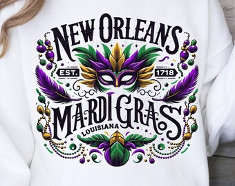 Op de afbeelding: Wit sweatshirt met een kleurrijk grafisch ontwerp met de tekst "New Orleans Mardi Gras Louisiana Est. 1718" met een paars, goud en groen Mardi Gras-masker in het midden.