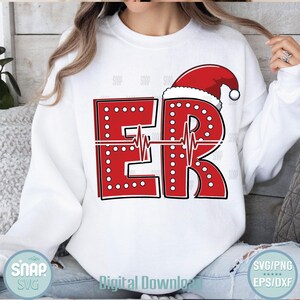 May include: White sweatshirt with a red "ER" design, featuring a Santa hat and a heartbeat line. The letters are outlined in black and dotted with white circles. The words "Digital Download" are at the bottom.