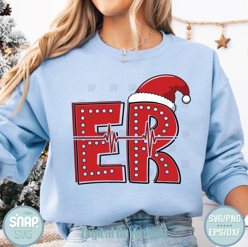 May include: Light blue sweatshirt with a red design that says "ER" with a Santa hat on top. The letters are outlined with small white dots and a heartbeat line runs through the letters. The word "SNAP" and "SVG" are in the bottom left corner.