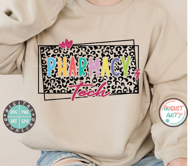 May include: A beige sweatshirt with a colorful "Pharmacy Tech" graphic on the front. The graphic is surrounded by a black leopard print frame with two pink hearts above the text.