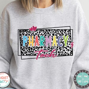 May include: A gray sweatshirt with a black and white leopard print design. The text "Pharmacy Tech" is written in colorful letters inside a black frame.