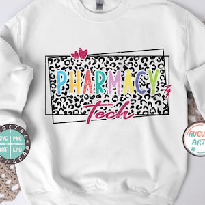 May include: A white sweatshirt with a black and white leopard print design. The text "Pharmacy Tech" is written in colorful letters with a pink heart above the text.