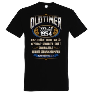Pode incluir: Camiseta preta com um gráfico prateado que diz "Oldtimer Modell 1954" com detalhes dourados. O gráfico também inclui o texto "Einzelstück - Echte Rarität Gepflegt - Gewartet - Geölt Originalteile Leichte Gebrauchsspuren Topzustand".