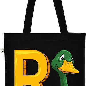 May include: Black canvas tote bag with a yellow letter R and a green duck with a white beak and white feathers around its neck.