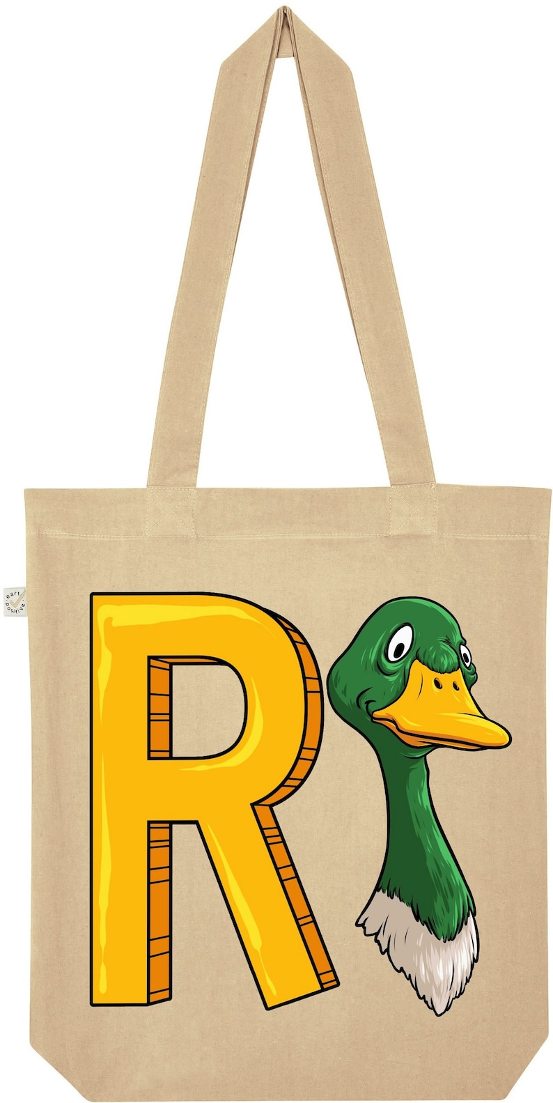 May include: A beige canvas tote bag with a yellow letter R and a green duck head illustration. The duck has a yellow beak and white feathers around its neck.