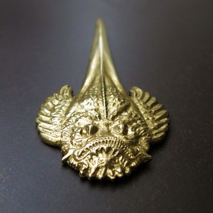 Pez piedra de arrecife (cuchillo de papel)