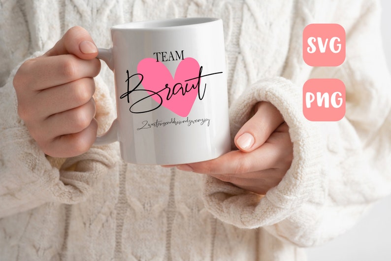 May include: White ceramic mug with a pink heart and black text that reads "Team Braut" and "Zweitbeste Freundin der Braut".