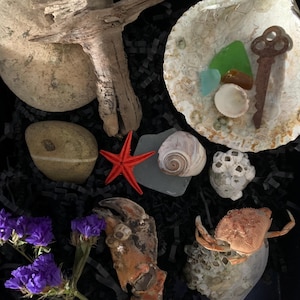 May include: A set of three ceramic mugs with a speckled, matte finish. The mugs are in shades of cream, light gray, and dark gray. Each mug has a simple, minimalist design, perfect for coffee or tea.