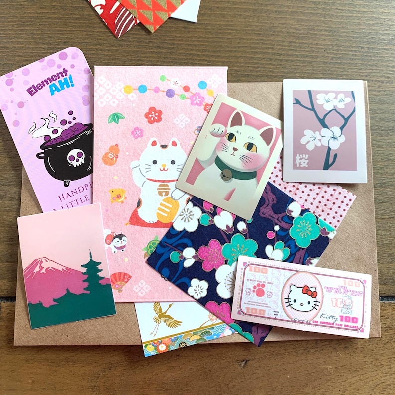 Pink lucky cat stationery bundle example with memo sheets, stickers and washi samples curated from Element Ah studio