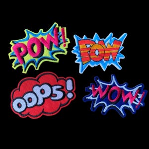 May include: Four embroidered fabric patches featuring comic book style sound effects. One patch says POW! in pink with a lime green and blue border. Another says POW in orange and red stripes with a blue border. OOPS! is in white on a red cloud. WOW! is in pink with a blue border.