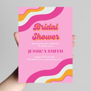 May include: Pink bridal shower invitation with a retro design featuring wavy lines in pink, white, and orange. The text reads "Bridal Shower" in a retro font, followed by "Please join us to celebrate the bride to be Jessica Smith, August 17th at 3 pm, 123 Pink Street | San Francisco, CA."