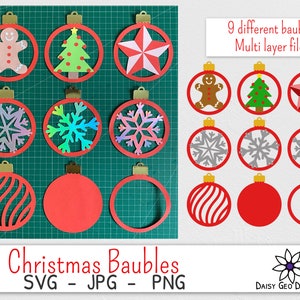 May include: Nine different Christmas bauble designs, each with multiple layers, for crafting. The designs include a gingerbread man, a Christmas tree, a star, snowflakes, and a striped bauble. The text "Christmas Baubles SVG - JPG - PNG" is at the bottom of the image. The text "9 different baubles Multi layer files" is at the top right of the image.