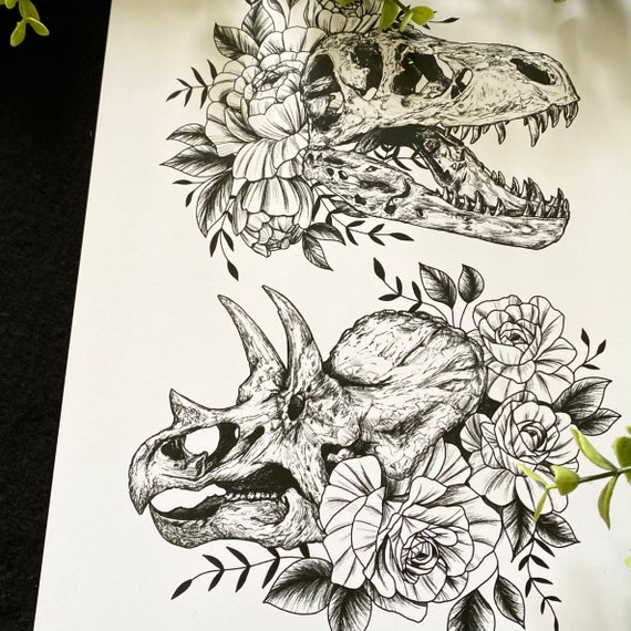 Premium Vector  Carnivorous dinosaur skull with red flowers on the top on  white background