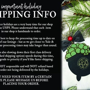 May include: Black and green cauldron Christmas ornament with a pentagram and the text "Winter Solstice 2021" and "The One, The Only". The ornament is hanging on a branch with a red bow. The text "Salem Supply Co." is in the bottom right corner.