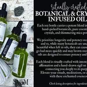 May include: Three small glass bottles filled with green liquid and labelled with the words "golden" and "SAIEM CO". The bottles are on a wooden surface with tarot cards and small grey stones. The text "ritually crafted BOTANICAL & CRYSTAL INFUSED OILS" is in the background.