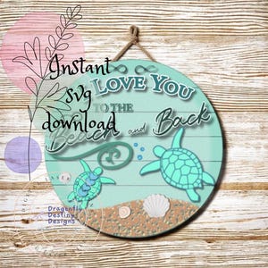 May include: A round wooden sign with a light blue background and white painted planks. The sign says "Love You To The Beach And Back" with a green infinity symbol and two turquoise sea turtles.
