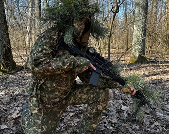 Camouflage suit , camouflage clothing , predator suit , sniper clothing , camouflage clothing for hunting . Tactical survival suit