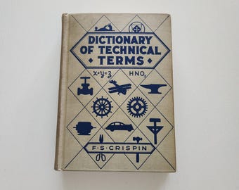 May include: A vintage book titled "Dictionary of Technical Terms" with blue text and illustrations on a tan cover. The cover features geometric shapes and symbols related to engineering and science. The author's name, F.S. Crispin, is also visible.