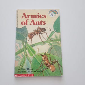 May include: A children's book titled "Armies of Ants" with illustrations of ants on green leaves. The cover features the text "Armies of Ants" in large letters, with the author and illustrator's names below.