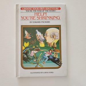 May include: A book cover with a green, yellow, and brown illustration of a frog, a man, and a mushroom. The title of the book is "Help! You're Shrinking" by Edward Packard. The book is part of the Choose Your Own Adventure series.