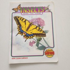 May include: A children's book titled "Insects" with a large yellow and black butterfly illustration on the cover. The book has a wipe-clean surface and is part of the "Science Safari Series".