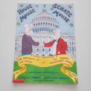 May include: A children's book titled "House Mouse, Senate Mouse" featuring illustrations of mice in suits in front of the U.S. Capitol building. The cover includes text about the Squeaker of the House and the Mouse-jority Leader.