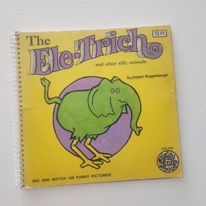 May include: A yellow book with a spiral binding titled "The Ele-Trich and other silly animals" by Robert Ringenberger. The cover features a green elephant with purple ears and a pink background. The book is a mix and match activity book with 100 funny pictures.