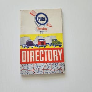 May include: A vintage Pure Truck Stop directory booklet featuring a white cover with a blue and white circular logo, a red and white sign, three semi-trucks in purple, red, and green, the word DIRECTORY in large white letters, and a map graphic.