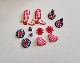 May include: A collection of fabric patches in various shapes and designs. Includes red and white gingham cowboy boots, ladybugs, flowers, hearts, and squares with heart details. The patches are in red, white, black, and gold.