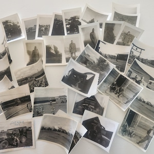 May include: A collection of black and white photographs, some showing military vehicles and soldiers, others showing buildings and landscapes.