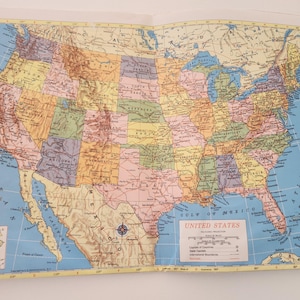 May include: A vintage map of the United States with state borders outlined in black and colored in shades of yellow, green, blue, and pink. The map includes the text "UNITED STATES" and "GULF OF MEXICO".