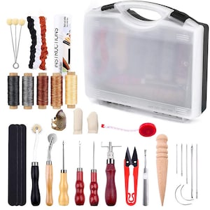 May include: A leathercraft tool kit with various tools and supplies. Includes a clear plastic carrying case, spools of thread, needles, scissors, a thimble, finger protectors, a tape measure, and other tools. The kit also includes instructions.