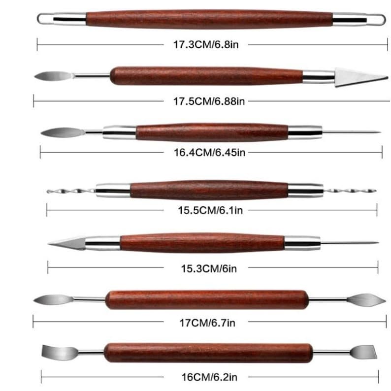 May include: Set of seven sculpting tools with wooden handles and different metal tips. The tools are laid out in a row with measurements in inches and centimeters.