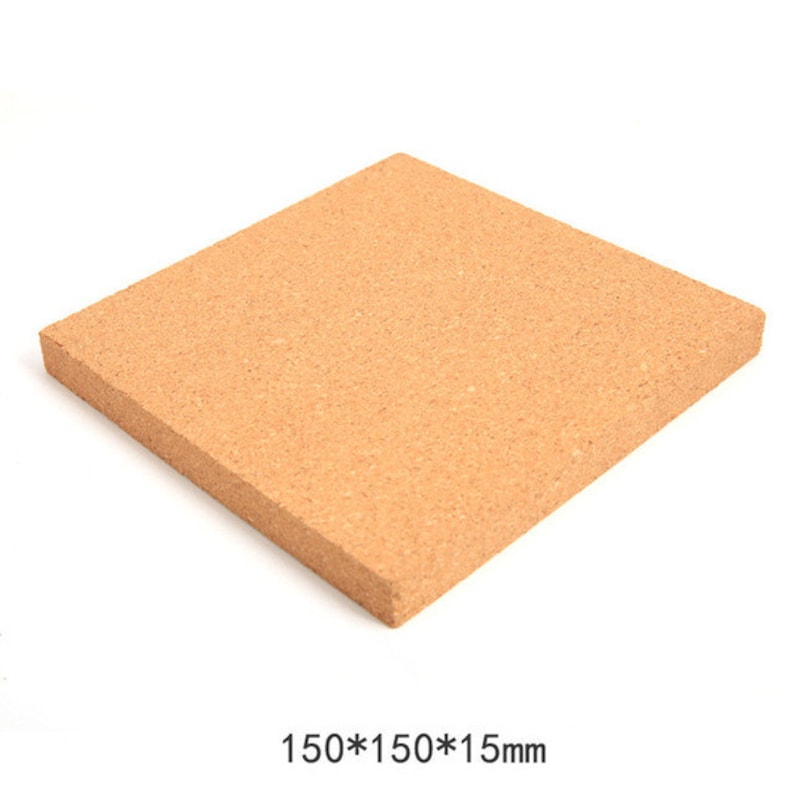 May include: A square, light brown cork board. The board is 150mm x 150mm x 15mm. The cork has a textured surface and is suitable for crafts, insulation, or as a bulletin board.