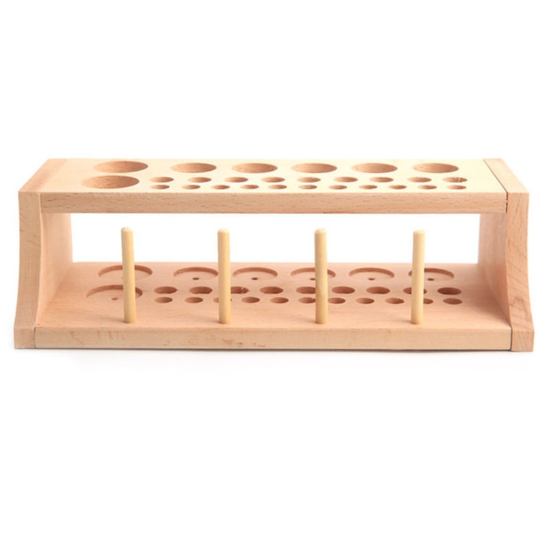 May include: A wooden organizer with multiple holes of different sizes for storing and organizing small items. The organizer has two levels and is made of natural wood.
