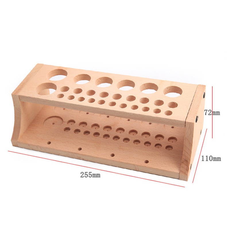 May include: Wooden organizer with multiple holes of different sizes for storing small items. The organizer measures 255 mm in length, 72 mm in height, and 110 mm in width.
