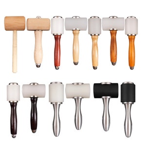 May include: A set of 12 leather working hammers with different colored handles and heads. The hammers have wooden, rubber, and metal heads. The handles are made of wood and metal.