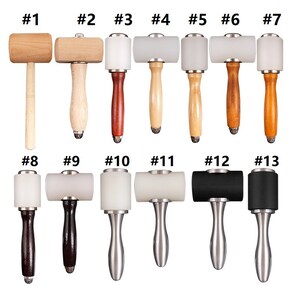 May include: A set of 13 leather working hammers with different colored handles and heads. The hammers are numbered 1 through 13.