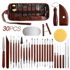 May include: A set of 30 pottery tools, including sculpting tools, a sponge, a wooden scraper, and a metal ribbon tool. The tools are arranged in a brown leather case with the words "30PCS" printed on the front.