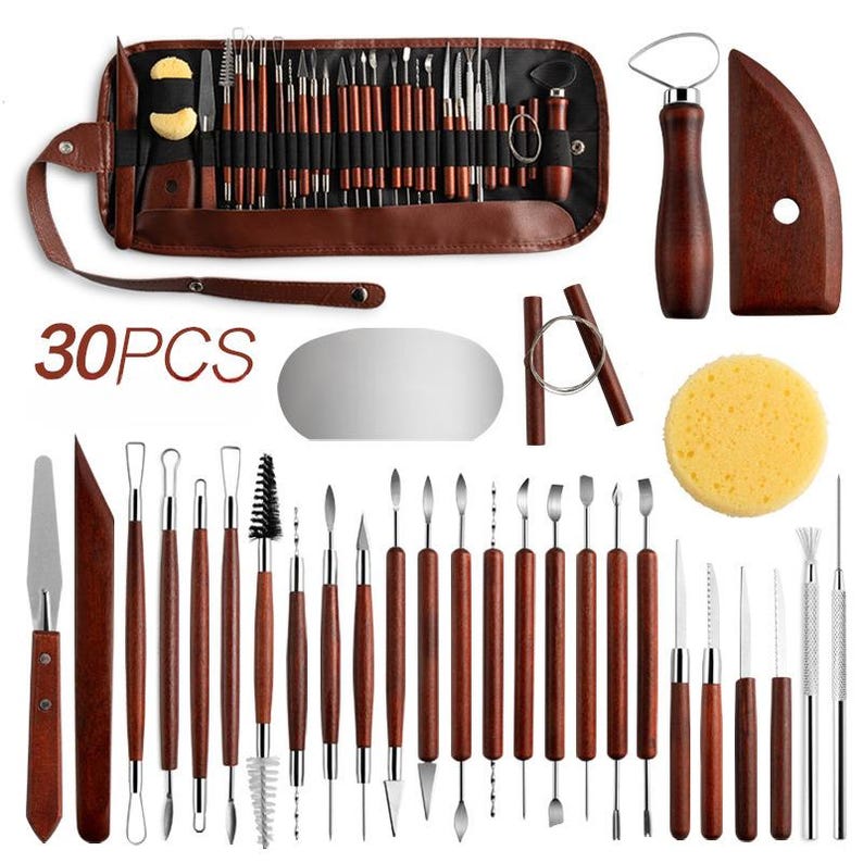 May include: A set of 30 pottery tools, including sculpting tools, a sponge, a wooden scraper, and a metal ribbon tool. The tools are arranged in a brown leather case with the words "30PCS" printed on the front.