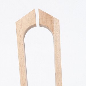 May include: Two unfinished wooden pieces for a chair back, each with a curved top and a rectangular shape.