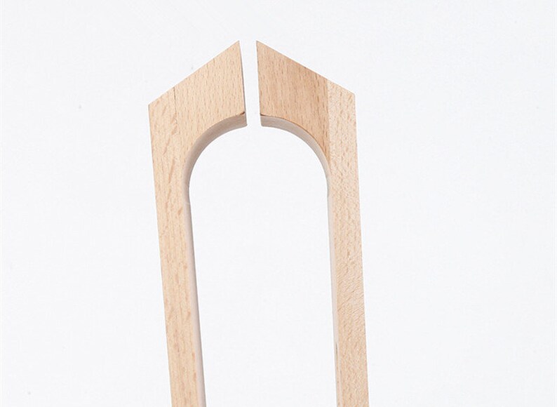 May include: Two unfinished wooden pieces for a chair back, each with a curved top and a rectangular shape.
