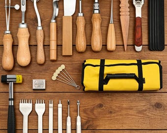 Un kit d'outils en cuir avec perforatrice pour la sculpture sur cuir