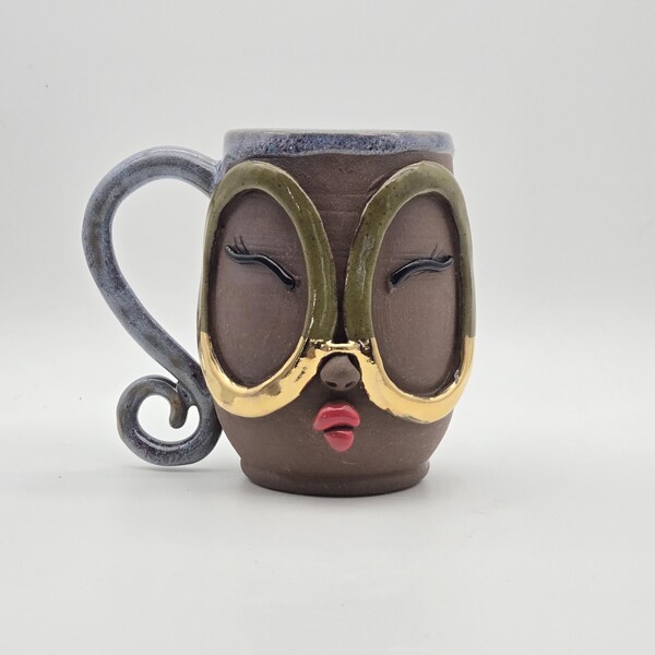 Handmade ceramic face mug