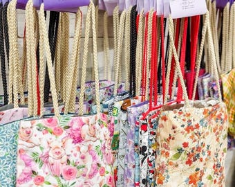 Pigs with pink roses tote bag