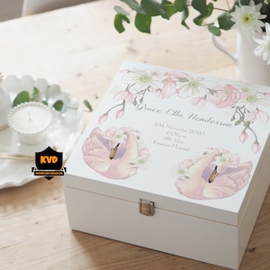 May include: White wooden keepsake box with a floral design and two pink swans. The box is decorated with the text "Grace Ella Henderson" and the date "10th November 2020".